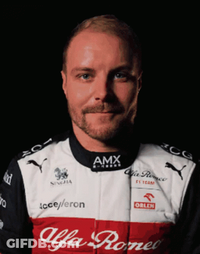 A Man With A Beard Wears A Red And White Shirt That Says Alfa Romeo GIF