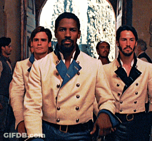 A Man With A Beard Wears A White Jacket With Buttons GIF