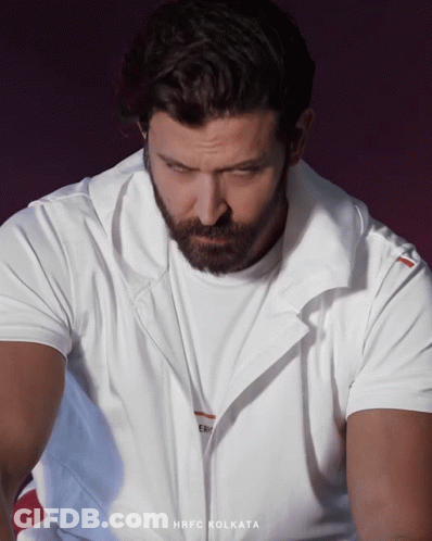 A Man With A Beard Wears A White Shirt That Says Hrfc Kolkata GIF