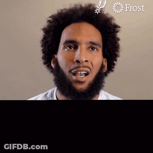 A Man With A Beard Wears A White Shirt With The Word Spurs On It GIF
