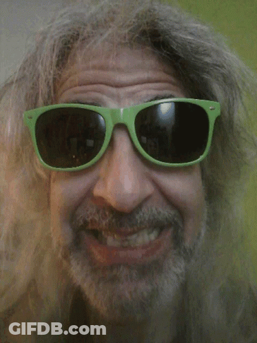 A Man With A Beard Wears Green Sunglasses GIF