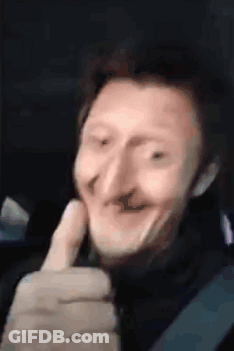 A Man With A Big Nose Is Making A Funny Face While Giving A Thumbs Up . GIF