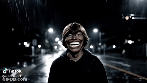Smiling Man On Night Street GIF