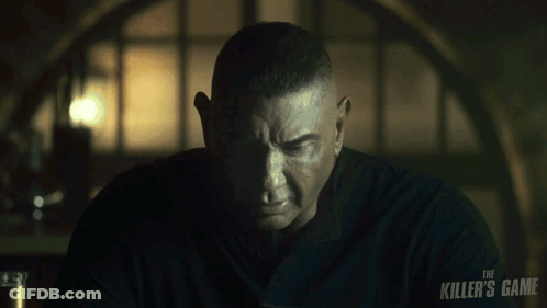 A Man With A Black Shirt That Says The Killer 'S Game On It GIF
