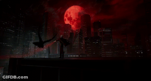 A Man With A Bloody Hand Is Reaching Out In The Dark GIF