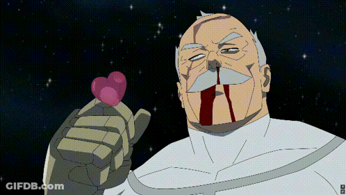 A Man With A Bloody Nose Is Holding A Pink Heart GIF