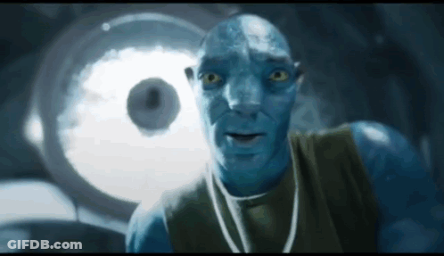 A Man With A Blue Face Is Looking At Something GIF
