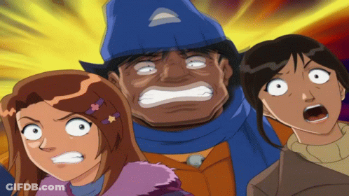 A Man With A Blue Hat Is Surrounded By Two Girls With Their Mouths Open GIF