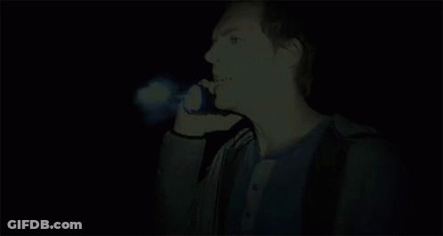 A Man With A Blue Light Coming Out Of His Face GIF