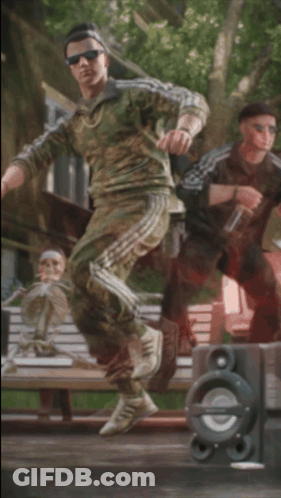 A Man With A Bottle Of Vodka In His Hand Stands In Front Of A Speaker GIF