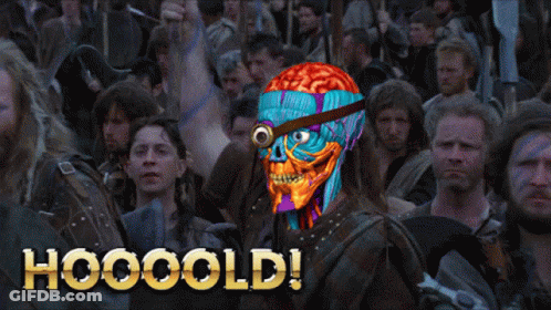A Man With A Brain On His Head Stands In Front Of A Crowd With The Words Hooooold Written On The Bottom GIF