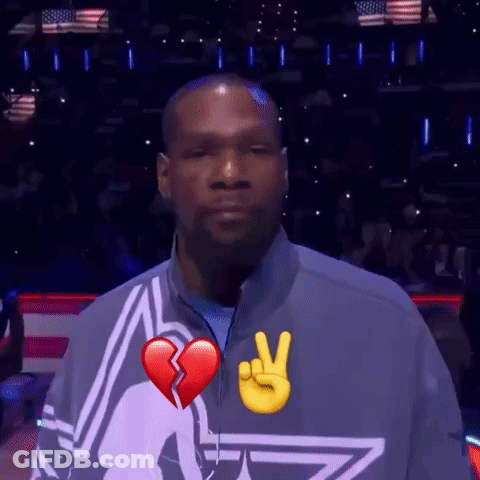A Man With A Broken Heart And A Peace Sign On His Shirt GIF