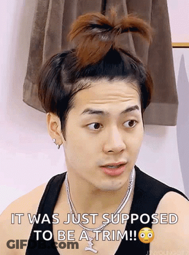 A Man With A Bun On His Head And A Necklace Says It Was Just Supposed To Be A Trim . GIF