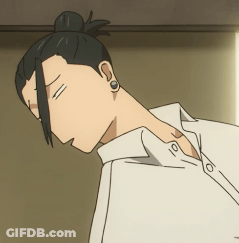 A Man With A Bun On His Head Is Wearing Earrings GIF