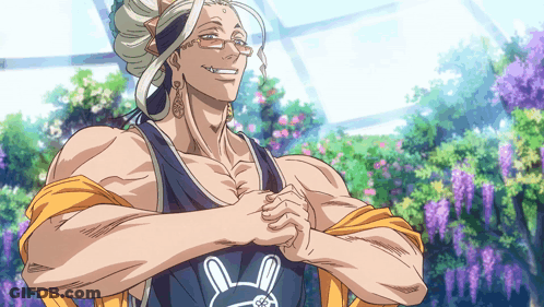 A Man With A Bunny On His Shirt Is Smiling With His Arms Crossed GIF