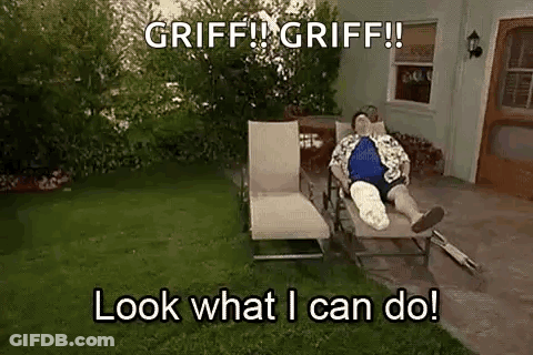 A Man With A Cast On His Leg Is Laying On A Lawn Chair In A Yard . GIF