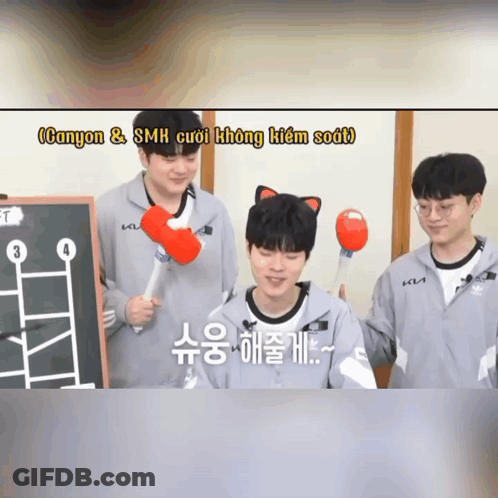 A Man With A Cat Ear On His Head Is Holding A Red Hammer In His Hand GIF