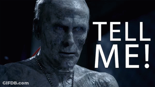 A Man With A Chain Around His Neck And The Words Tell Me On The Bottom GIF