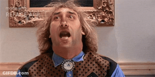 A Man With A Clock Around His Neck Is Making A Surprised Face . GIF
