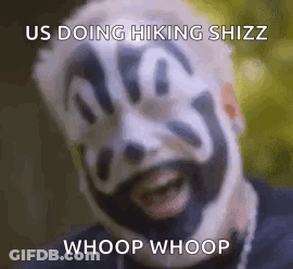 A Man With A Clown Face Painted On His Face Is Smiling . GIF