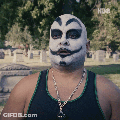 A Man With A Clown Face Painted On His Face Is Wearing A Black Tank Top GIF