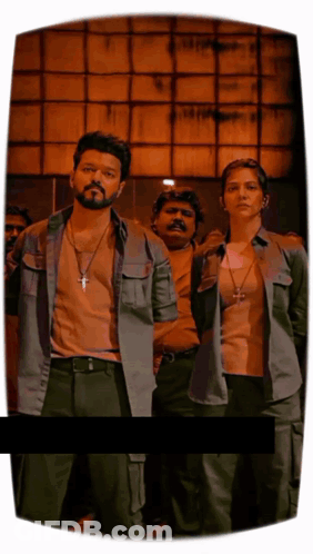 A Man With A Cross Necklace Stands Next To A Woman With A Cross Necklace GIF