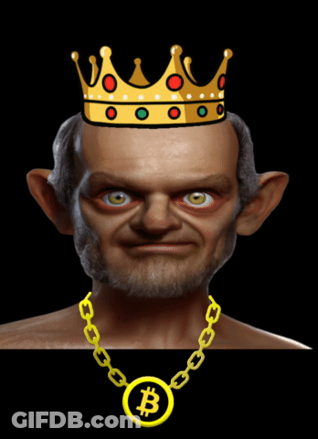 A Man With A Crown On His Head And A Chain With A B On It GIF