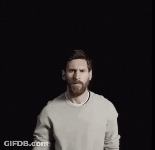A Man With A Crown On His Head Points His Finger Up GIF