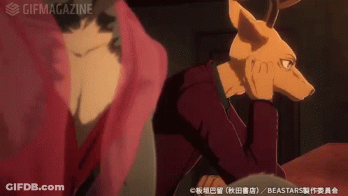 A Man With A Deer Head Is Sitting Next To A Woman In A Red Dress . GIF