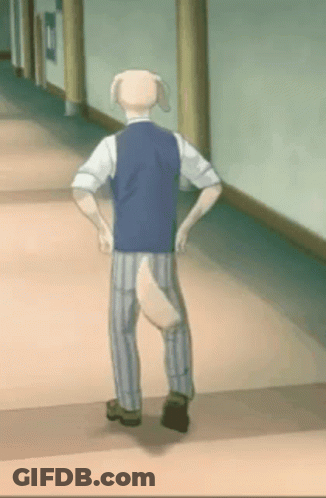 A Man With A Dog Tail Is Walking Down A Hallway . GIF