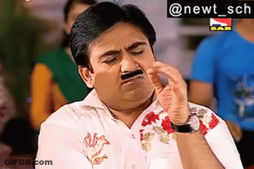 A Man With A Fake Mustache Is Making A Funny Face With His Hand . GIF