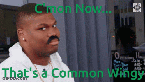 A Man With A Fake Mustache Is Standing In Front Of A Sign That Says " C'mon Now " GIF