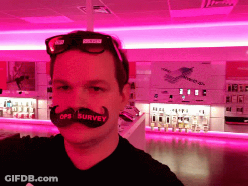 A Man With A Fake Mustache That Says Ops Survey On It GIF