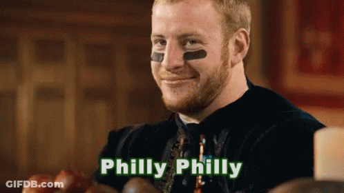 A Man With A Football On His Face And The Word Philly On The Bottom GIF