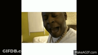 A Man With A Gold Chain Around His Neck Is Making A Face GIF