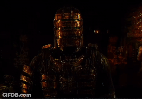 A Man With A Gold Helmet Is Standing In A Room GIF