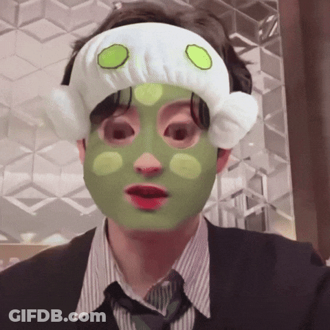 A Man With A Green Mask On His Face And A White Headband GIF