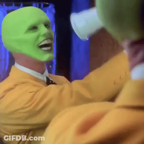 A Man With A Green Mask On His Face Is Laughing GIF