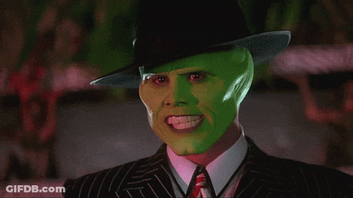A Man With A Green Mask On His Face Is Wearing A Hat GIF