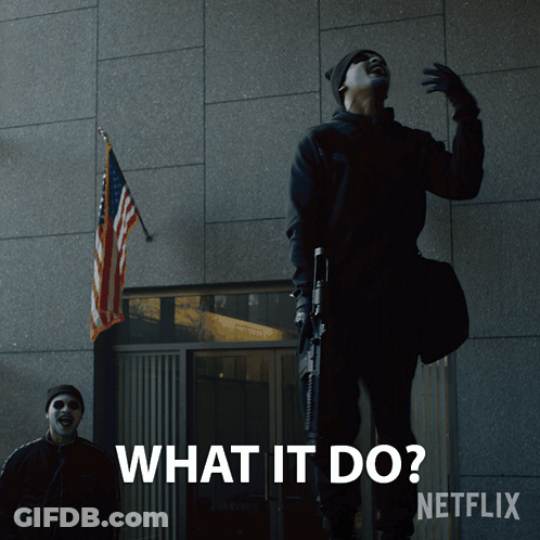 A Man With A Gun Is Standing In Front Of A Building With The Words What It Do Netflix GIF