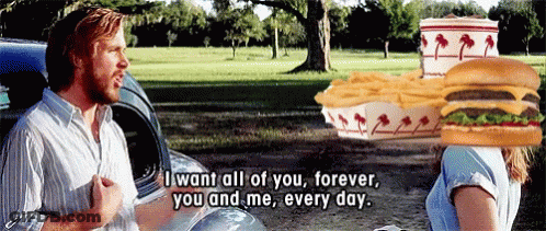 A Man With A Hamburger On His Head Talks To A Woman GIF