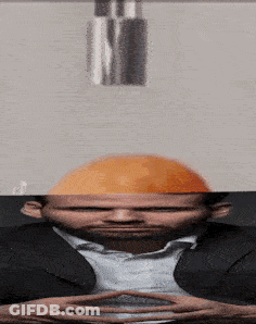 A Man With A Hard Hat On His Head Looks At Something GIF