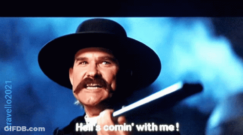 A Man With A Hat And A Mustache Is Holding A Gun And Says Hell 'S Comin ' With Me GIF