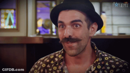 A Man With A Hat And A Mustache Is On A Tv Show Called Talent GIF