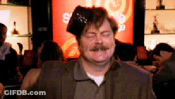 A Man With A Hat On His Head In Front Of A Sign That Says ' Sale ' GIF