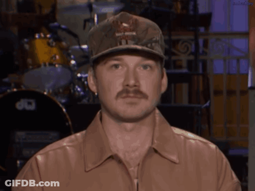 A Man With A Hat That Says Harley Davidson GIF
