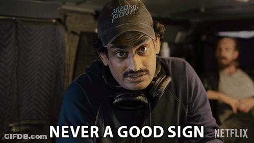 A Man With A Hat That Says Sneaky Pickles GIF