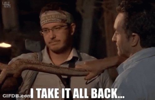 A Man With A Headband That Says Survivor Holds A Snake And Says " I Take It All Back " GIF