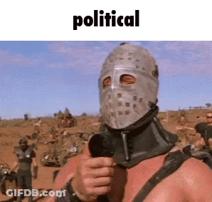 A Man With A Helmet On His Head Is Holding A Microphone And Giving A Thumbs Up Sign . GIF