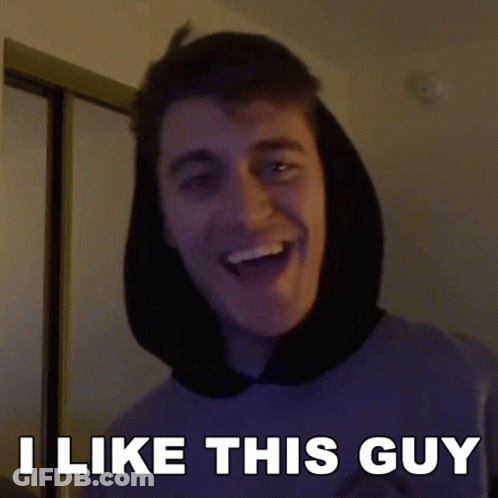 A Man With A Hood On His Head Is Smiling And Says I Like This Guy GIF